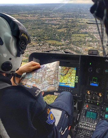 Tactical Flight Officer reading map