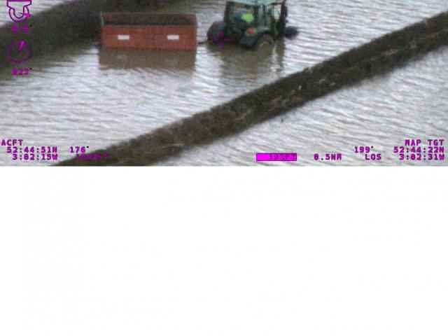 Tractor in floodwater